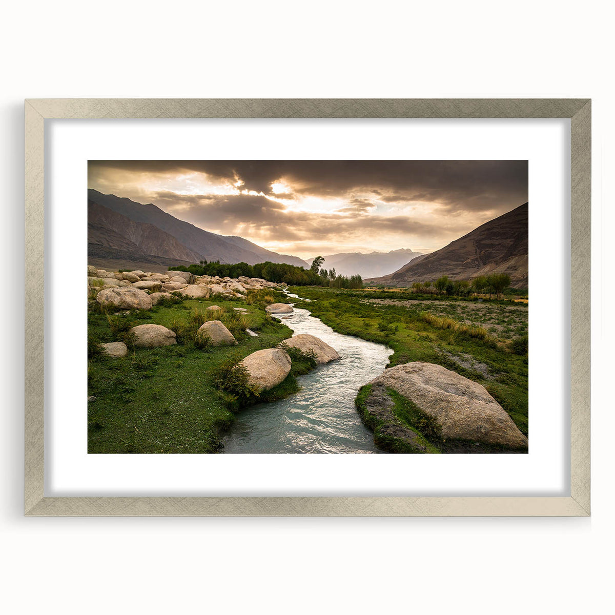Textured abstract art print of a Middle Eastern scenery in muted earth tones, framed in silver, ideal for bedroom art.
