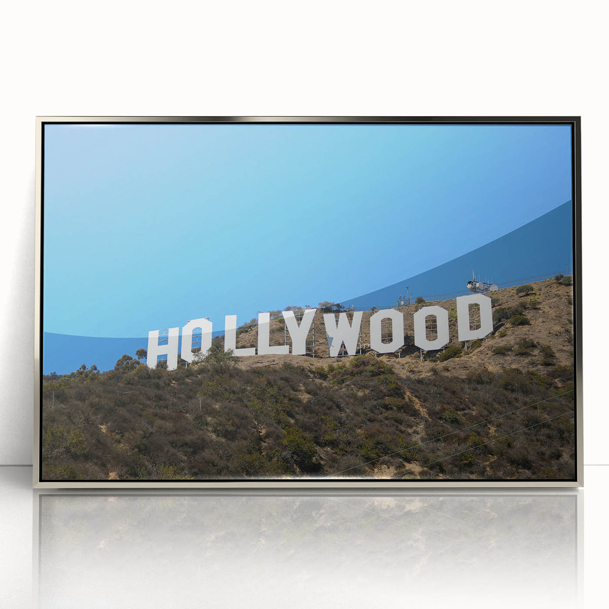 Mid-century modernist art depicting the Hollywood, California scenery in silver-framed acrylic.