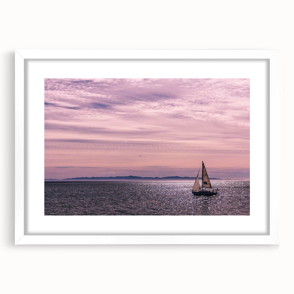 Abstract art print of Santa Barbara in muted blue and white tones, framed in white, ideal for dining room decor.