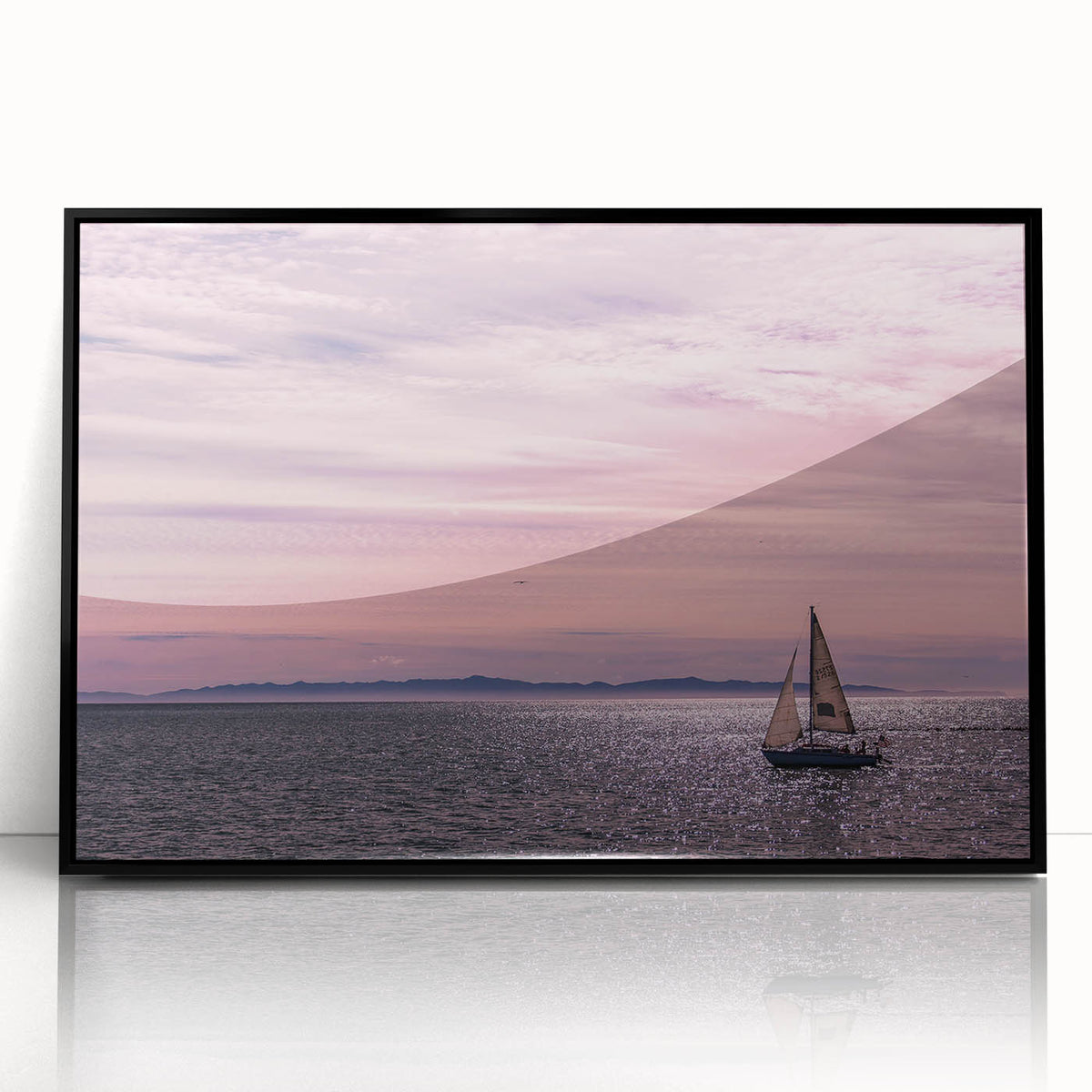 Large abstract wall art depicting the Santa Barbara coastline in muted blue and gray tones on a framed acrylic print.
