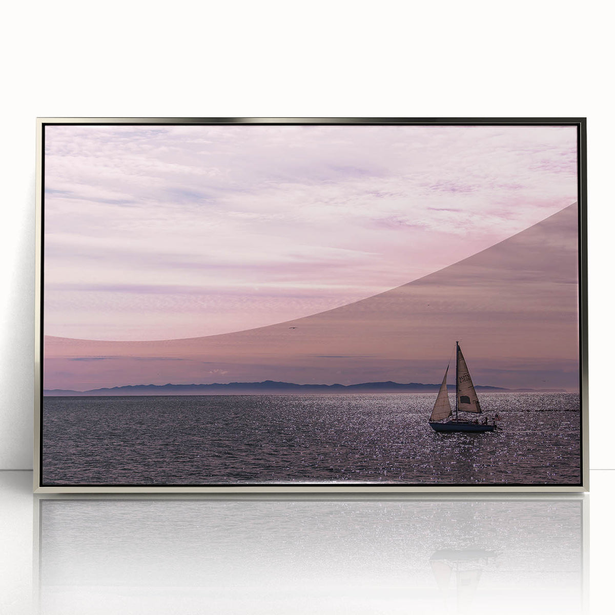 Mid-century modernist art of Santa Barbara coastline in muted blue and gray tones on a silver-framed acrylic print.