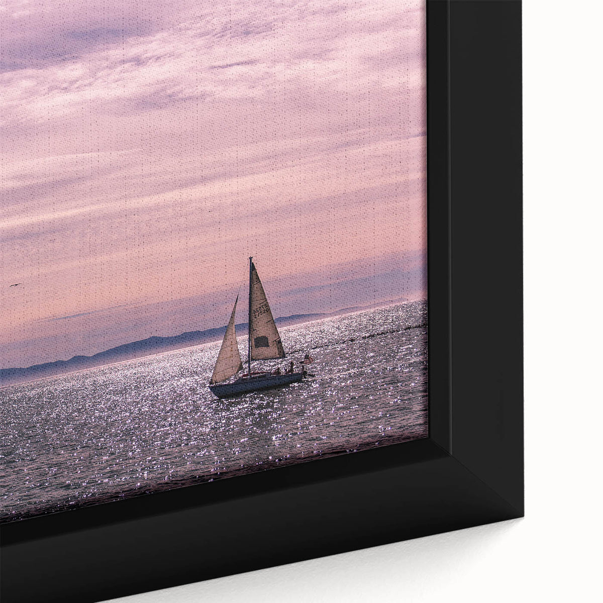 Black wall art depicting the Santa Barbara coastline in textured, colorful art on a framed canvas.