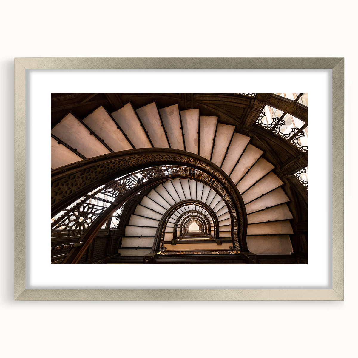 Textured art depicting an abstract Chicago skyline in muted blue and gray tones on a framed silver mat.