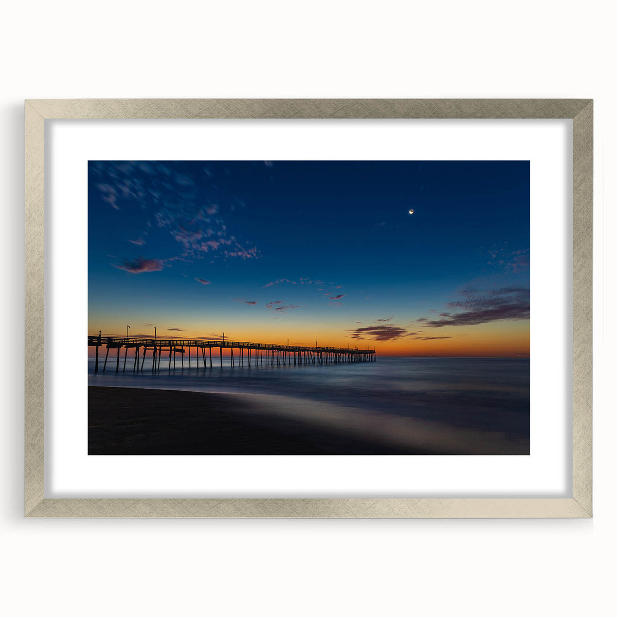 Textured art of Cape Hatteras with abstract design in cool blue tones, framed in silver, ideal for bedroom wall decor.