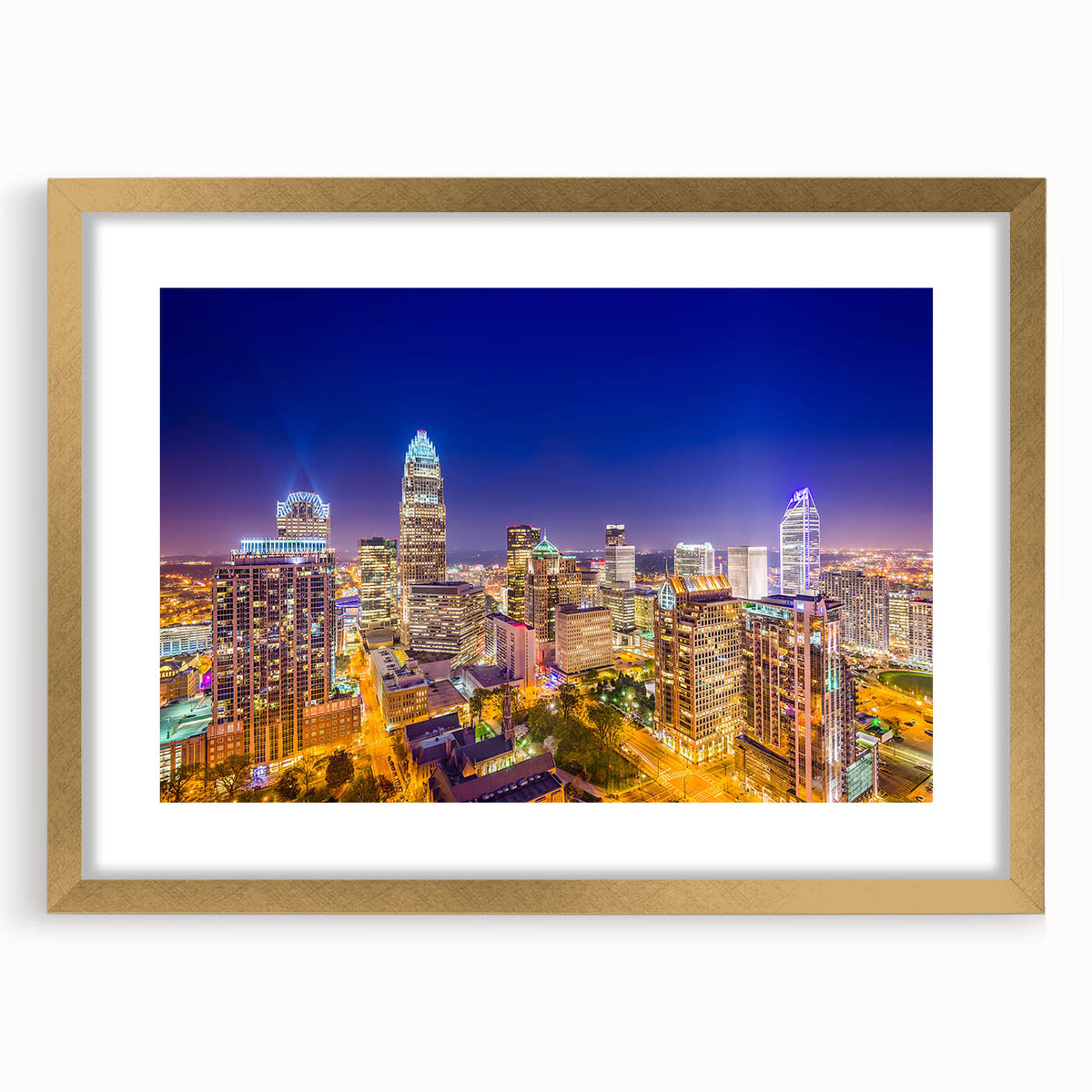 Extra large abstract art print of Charlotte skyline in muted gray and blue tones on a framed canvas.