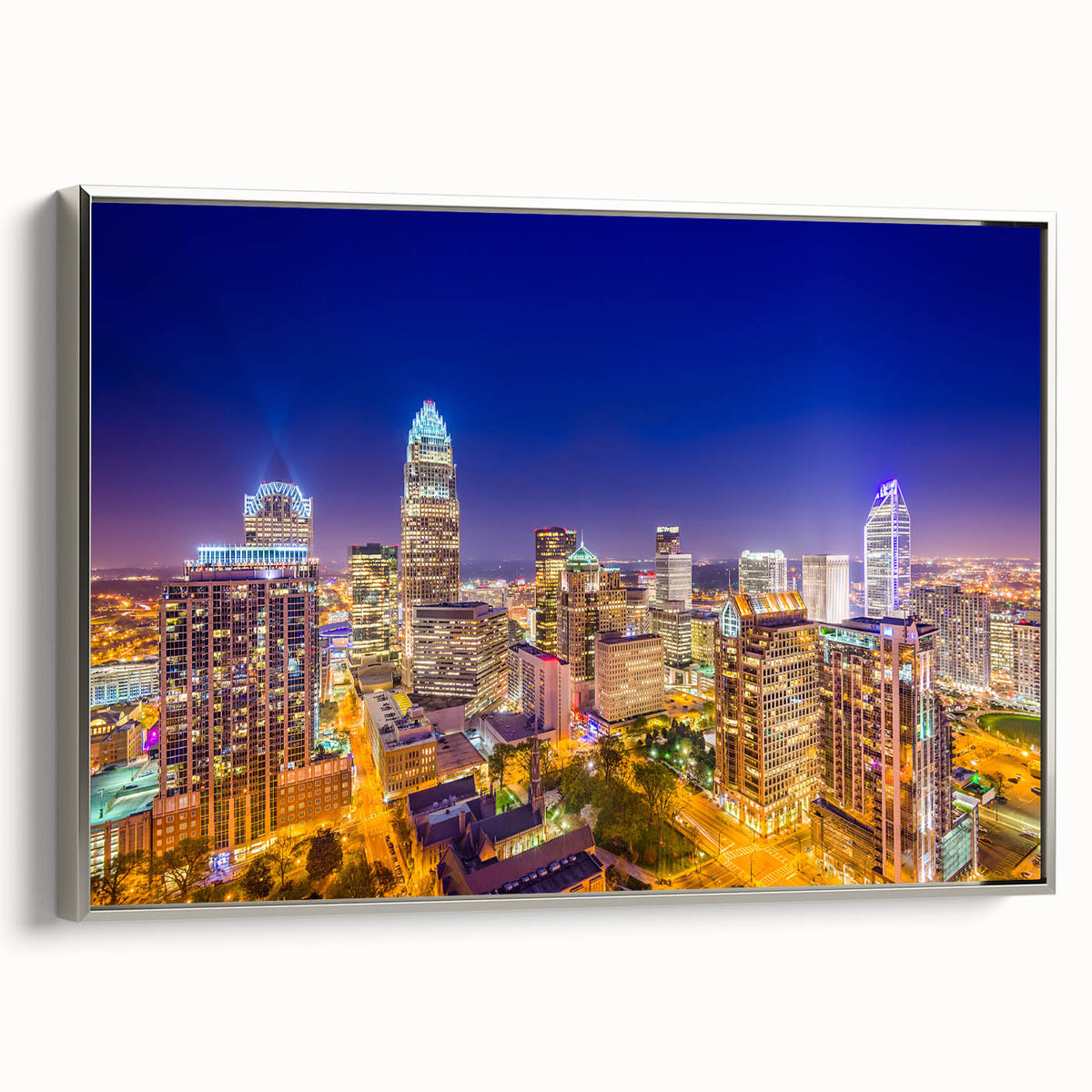 Framed canvas of a vintage Charlotte, North Carolina landscape painting featuring colorful art in black and silver tones.