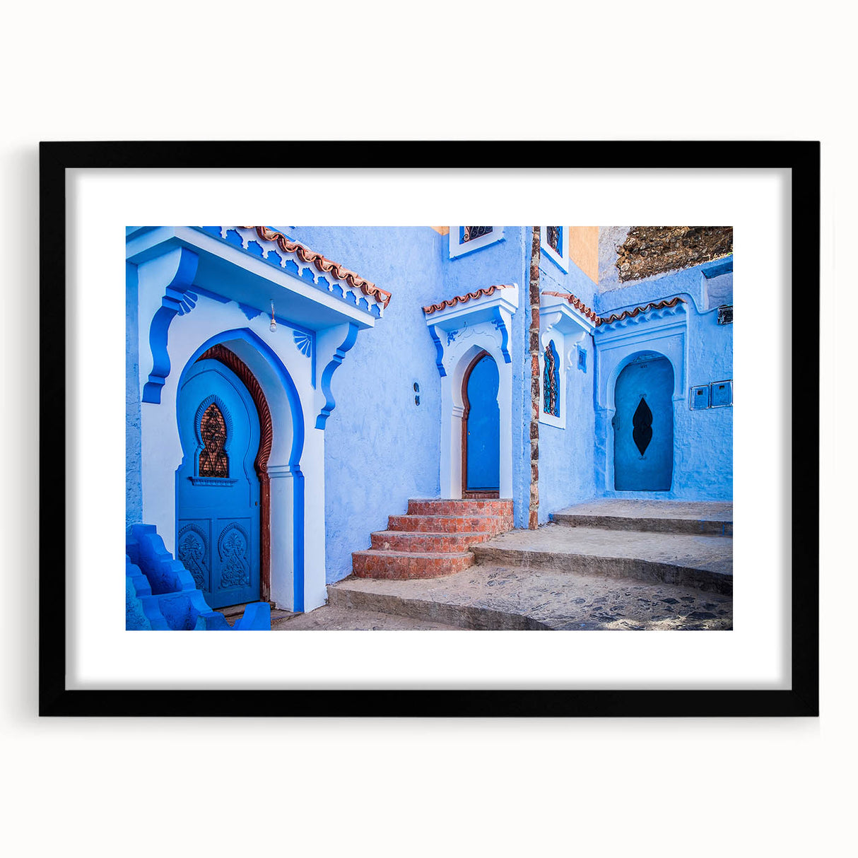Extra large abstract art print of a colorful Moroccan landscape in a black frame, ideal for living room decor.