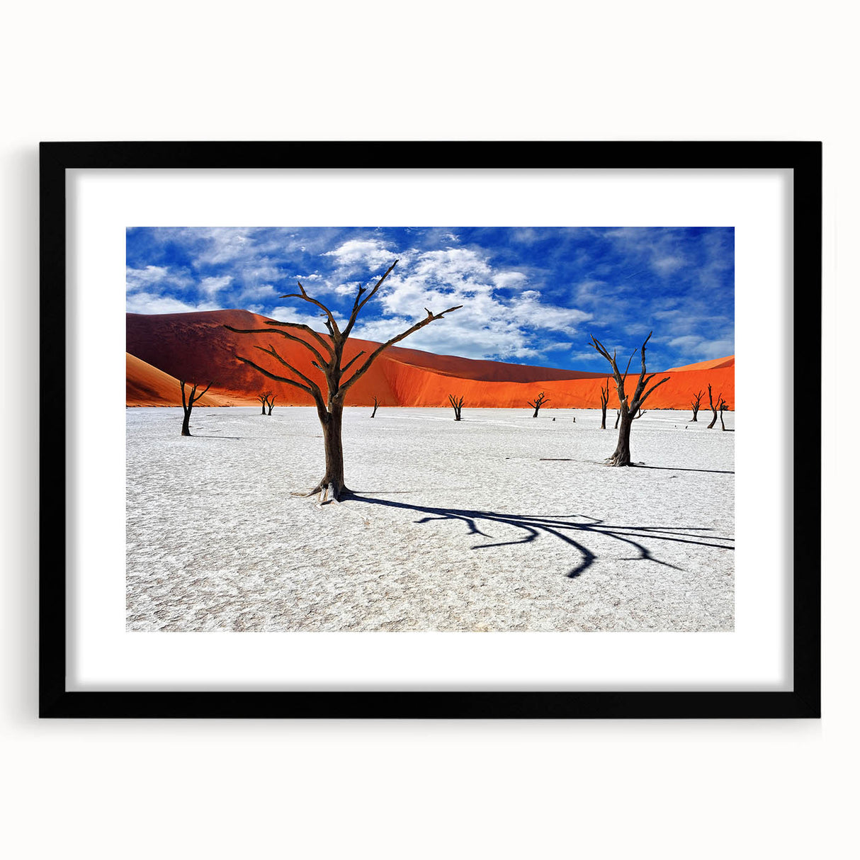 Abstract art print featuring textured, colorful depiction of Namibian scenery on a large framed canvas.