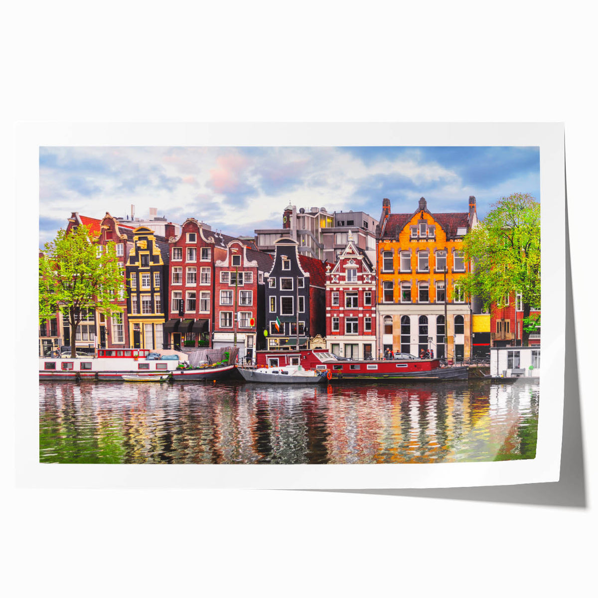 Rolled canvas print of a European scenery with vibrant floral elements in lush green and pink.