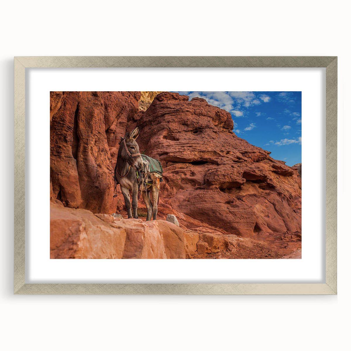 Textured abstract art print depicting a Middle Eastern landscape in muted earth tones, framed with a silver mat.