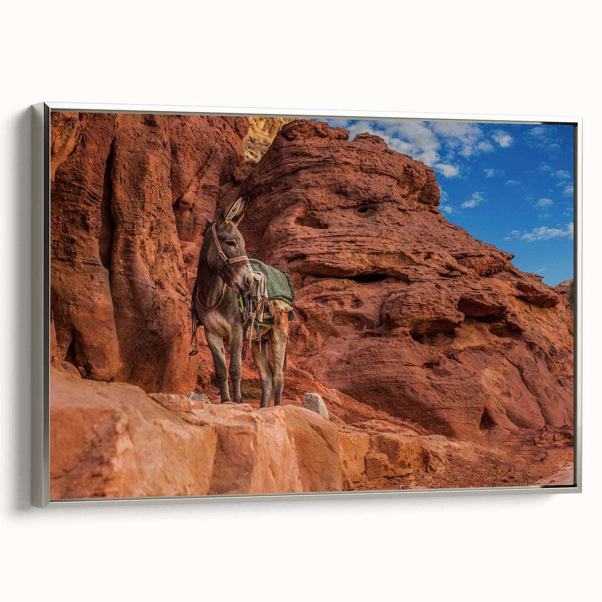 Vintage-style landscape art painting of a Middle Eastern scenery on a silver-framed canvas.