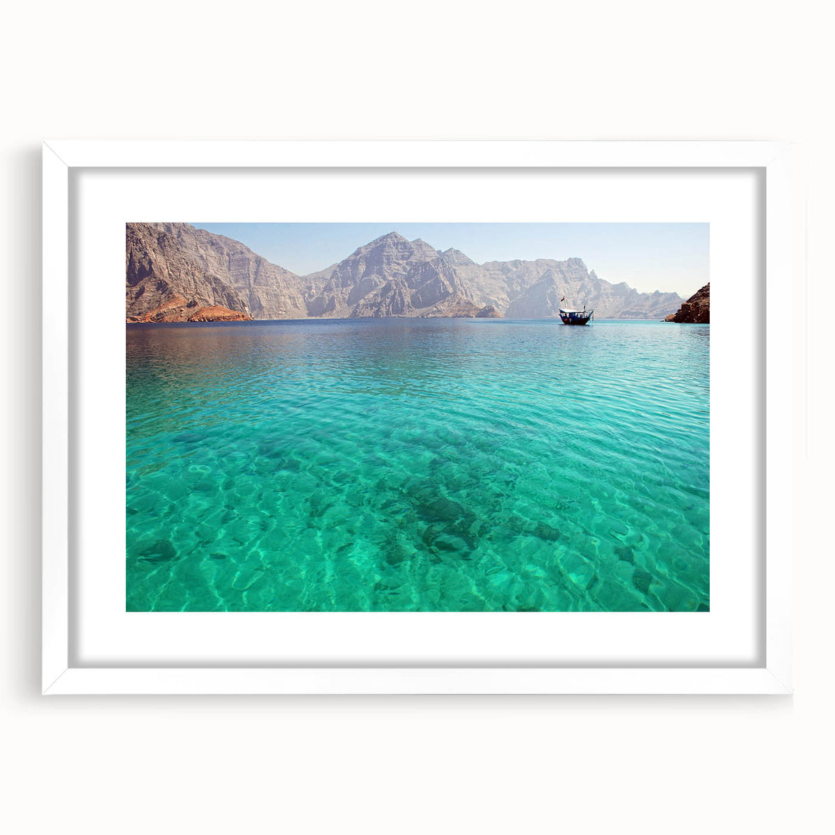 Abstract art print of an Omani landscape in muted earth tones on a framed white mat, ideal for dining room decor.