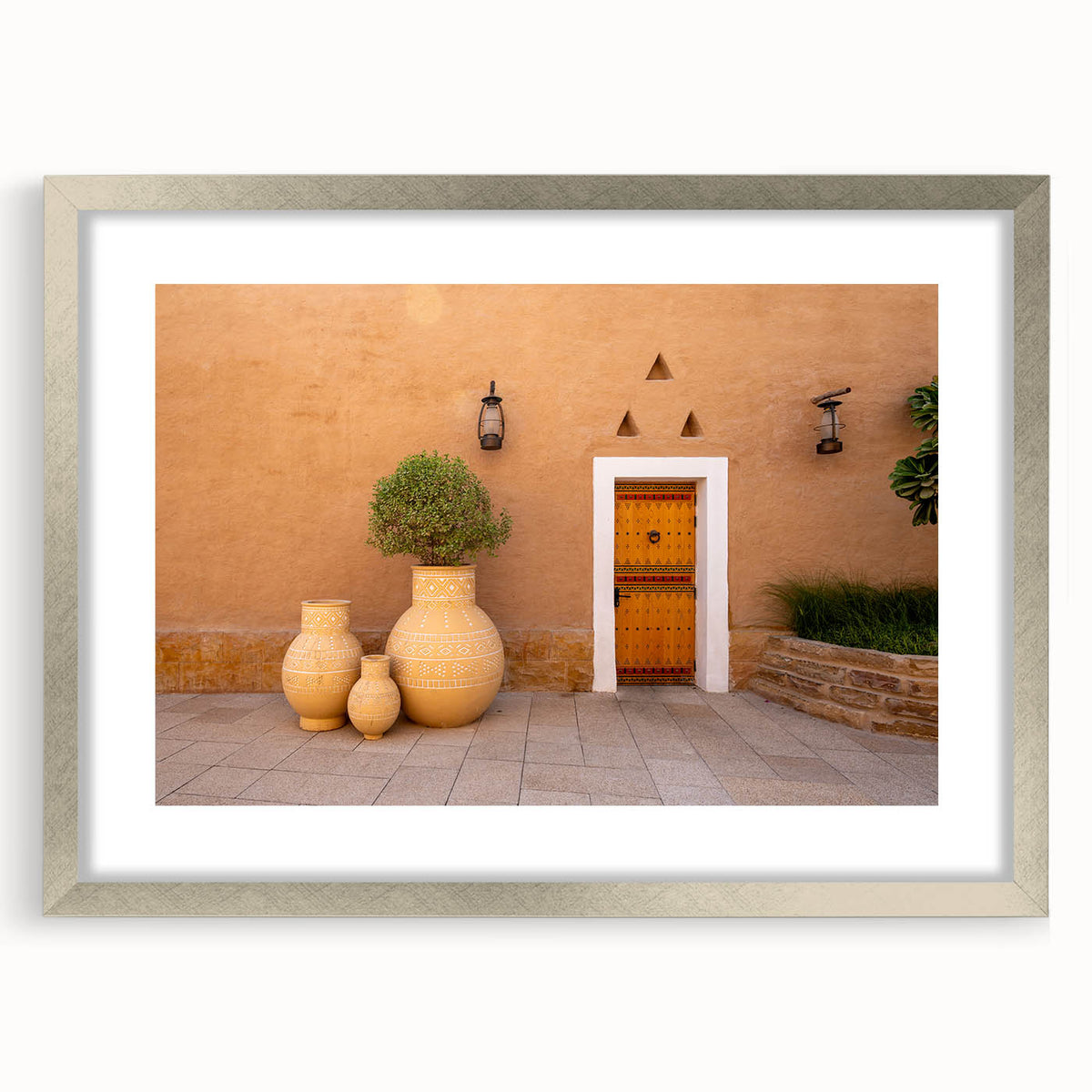 Textured abstract art print of a Middle Eastern landscape in muted earth tones on a framed canvas.