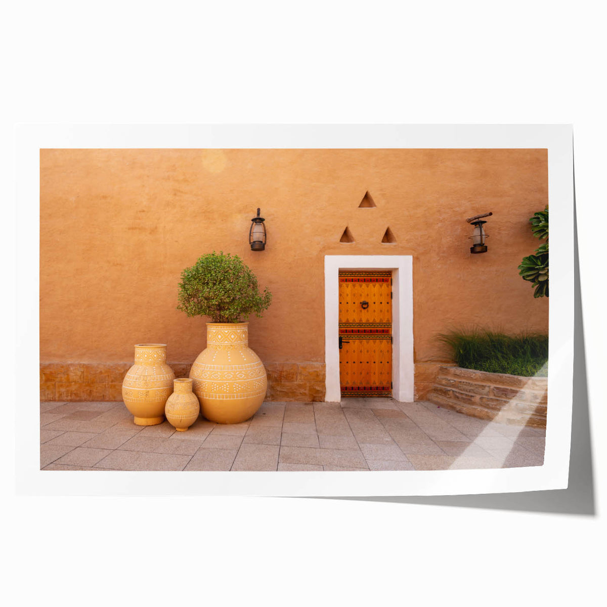 Extra large rolled print depicting a Saudi Arabian landscape with floral elements in muted earth tones.