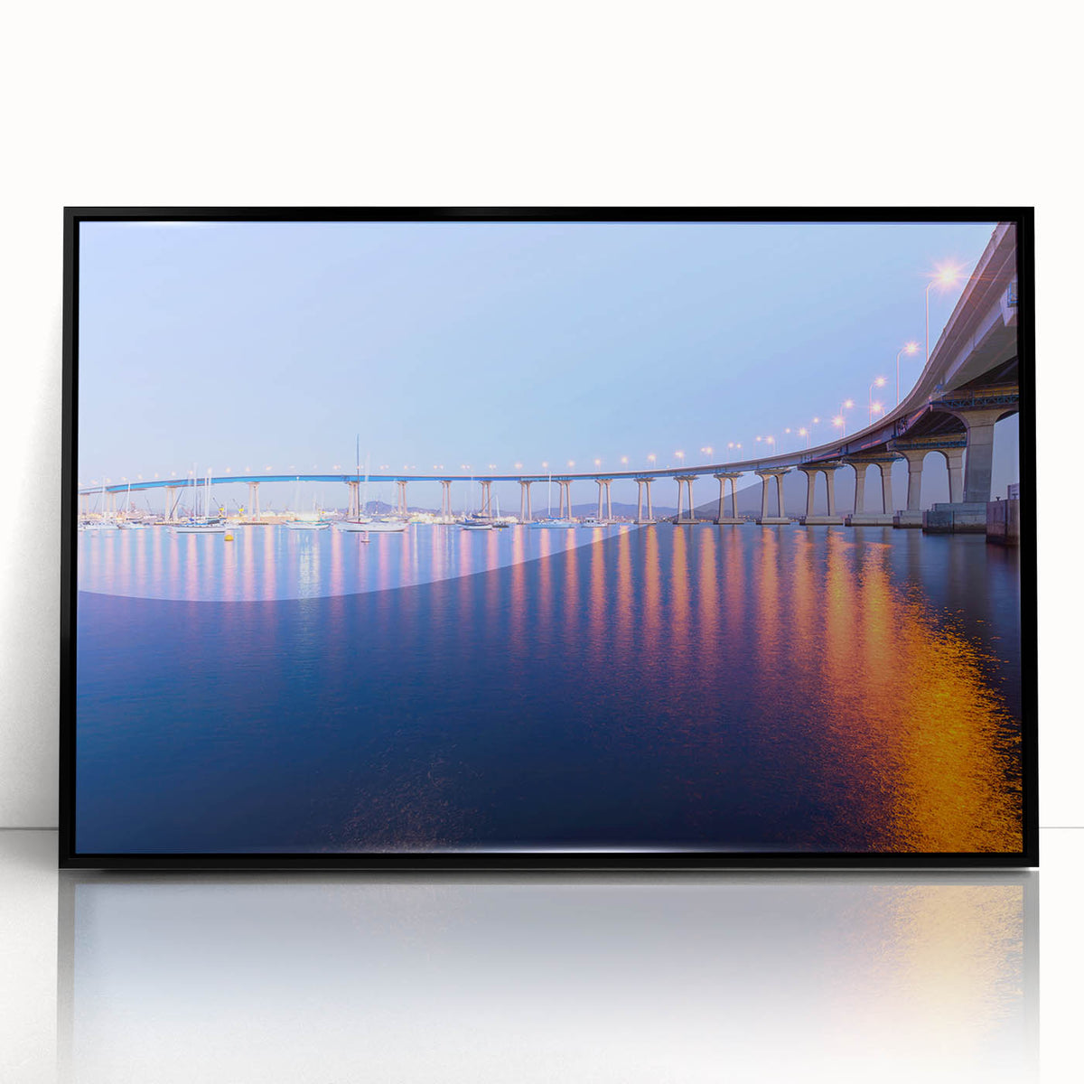Large abstract wall art depicting the Coronado, California skyline in muted gray and blue tones on a framed acrylic print.