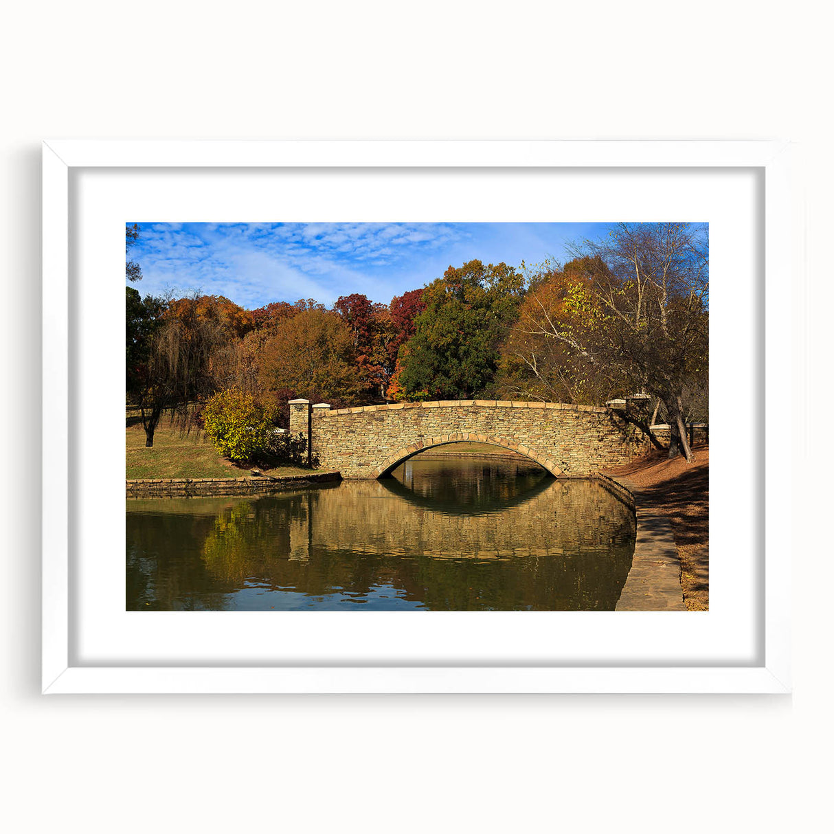 Abstract art print of Charlotte skyline in muted blue and gray tones on a framed white mat, suitable for dining room decor.