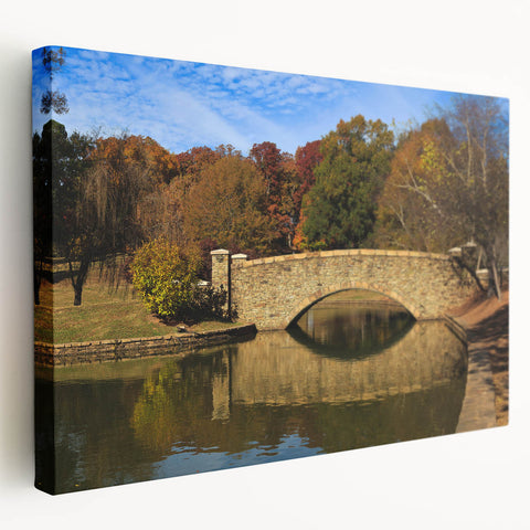 Side view of a stretched canvas depicting the Charlotte, North Carolina skyline in muted blue and gray tones.