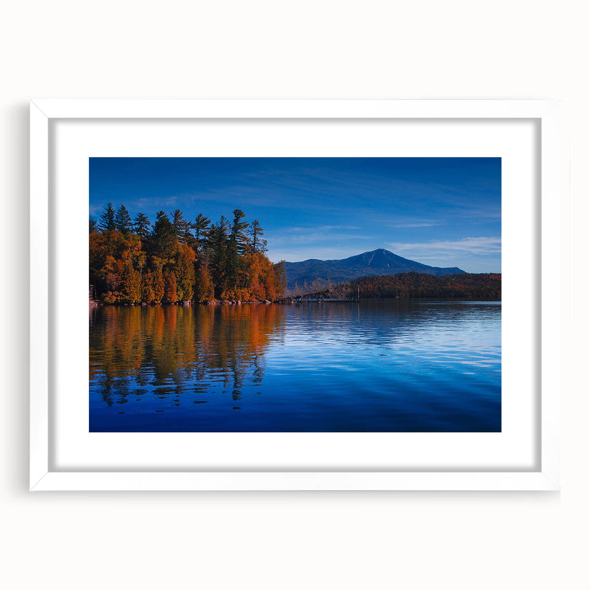 Abstract art print of Adirondack scenery in muted earth tones, framed in white, suitable for bedroom or dining room decor.