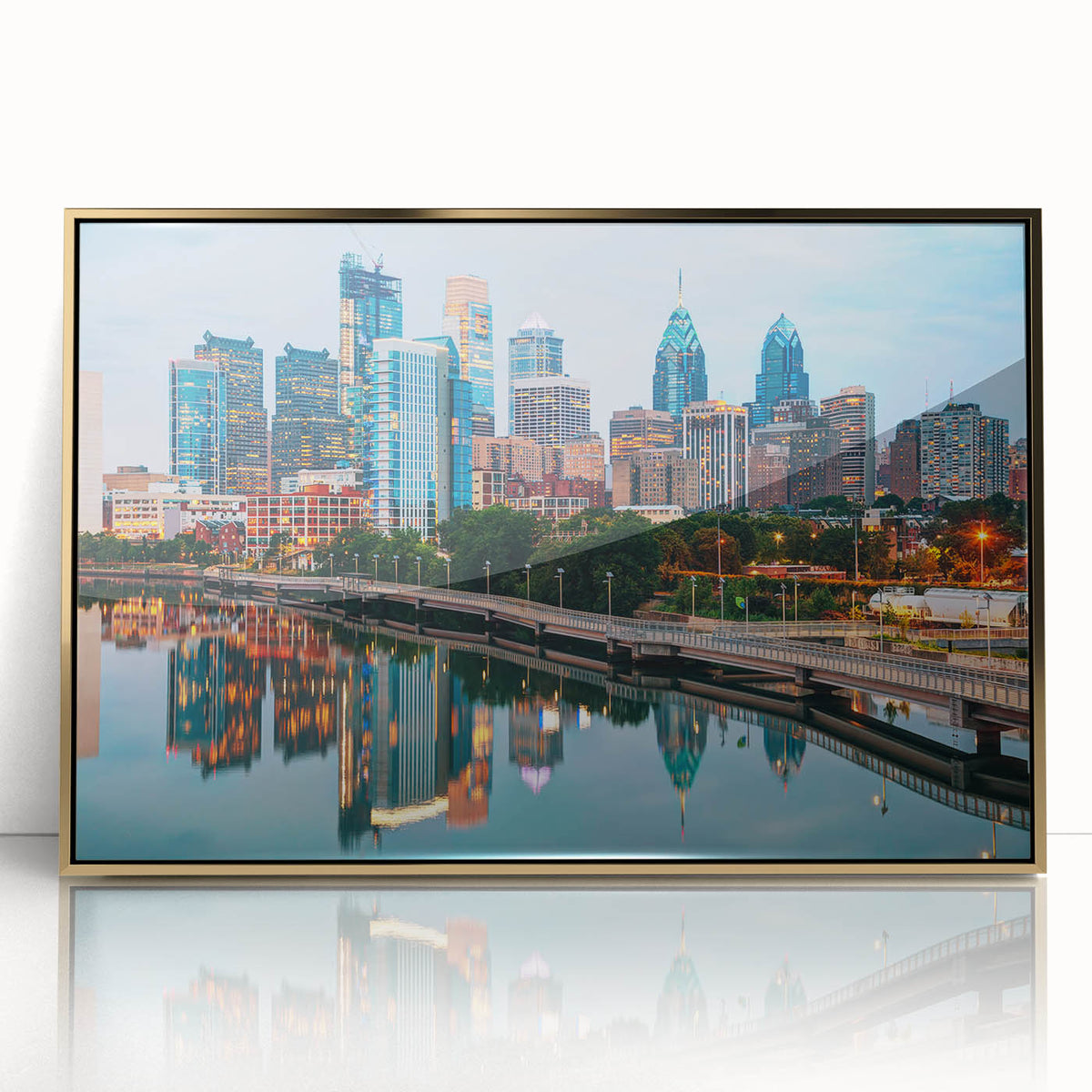 Large art print of Philadelphia skyline in muted gold and blue tones, framed acrylic, mid-century modernist style.