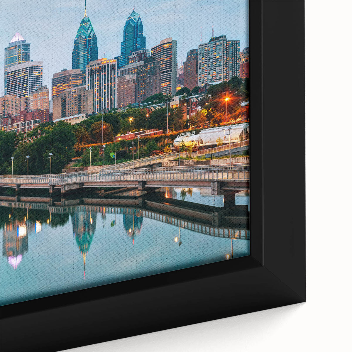 Framed canvas of Philadelphia skyline in textured black with colorful accents, ideal for living room decor.