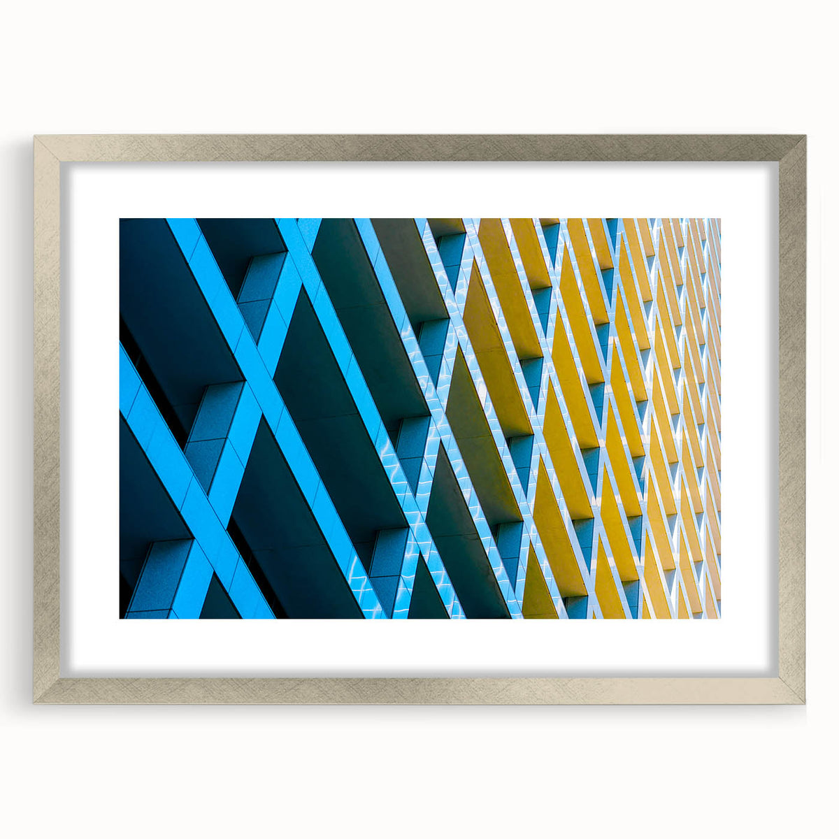 Textured abstract art print of Houston skyline in muted earth tones on a framed silver mat, suitable for bedroom decor.