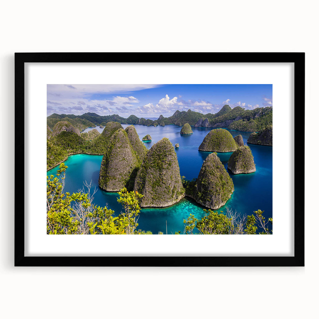 Extra large abstract art print depicting a colorful, textured Indonesian landscape on a framed black mat.