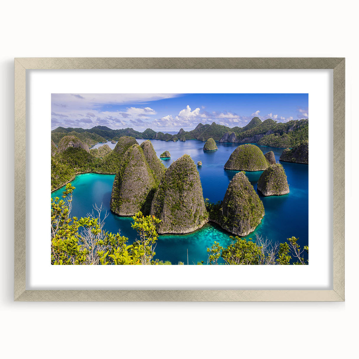Textured abstract art print depicting a serene Indonesian landscape in muted earth tones, framed in silver.