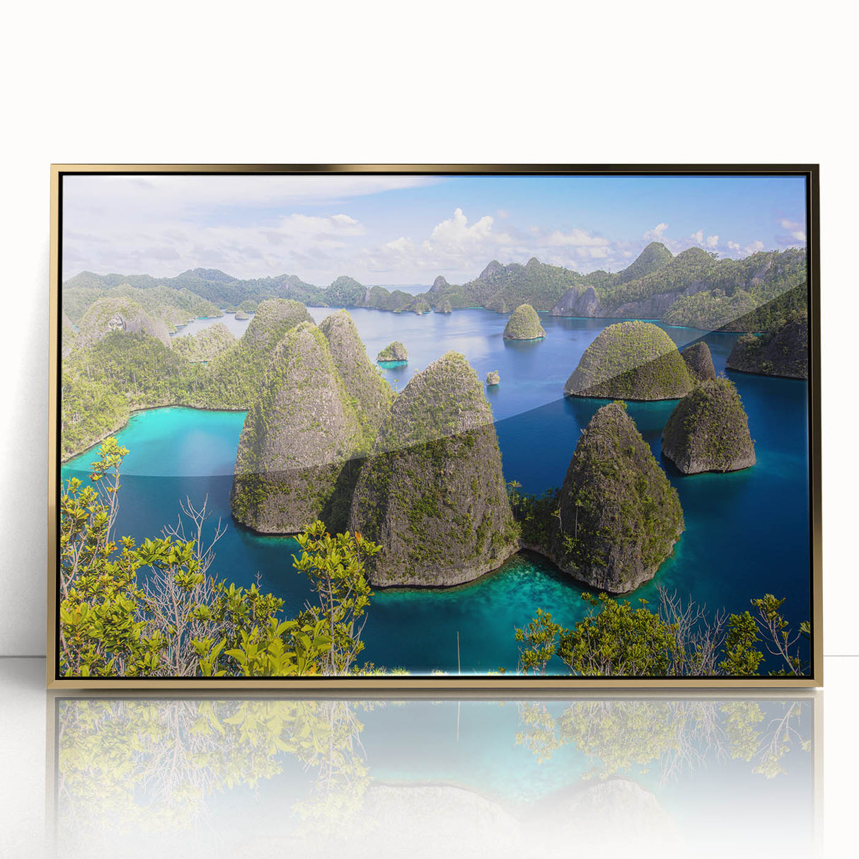 Framed acrylic print of an Indonesian landscape in gold and green tones.