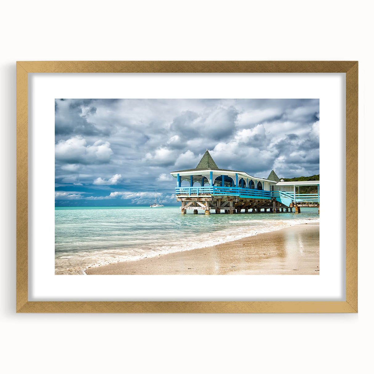 Abstract art print of Caribbean scenery in muted blue and green tones on a framed gold mat, ideal for dining room decor.
