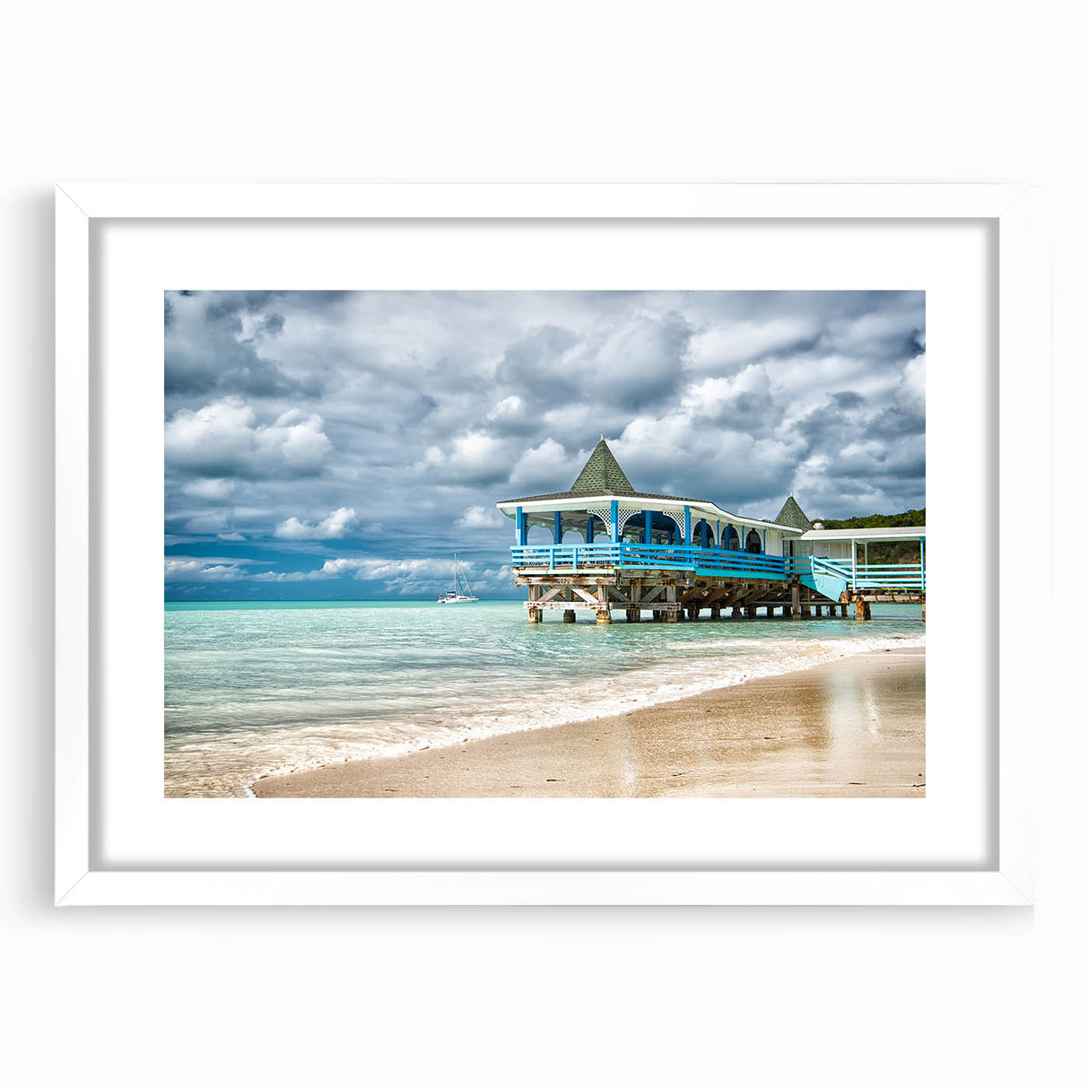 Textured abstract art print depicting Caribbean scenery in vibrant blue and green tones, framed with a white mat.