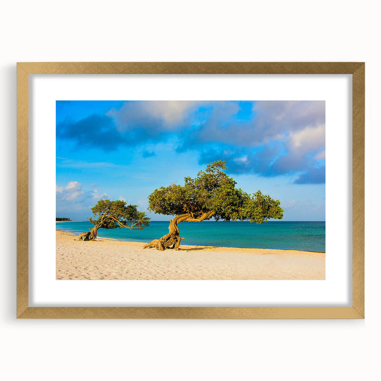 Abstract art print of Caribbean scenery in muted blue and green tones, framed in gold.