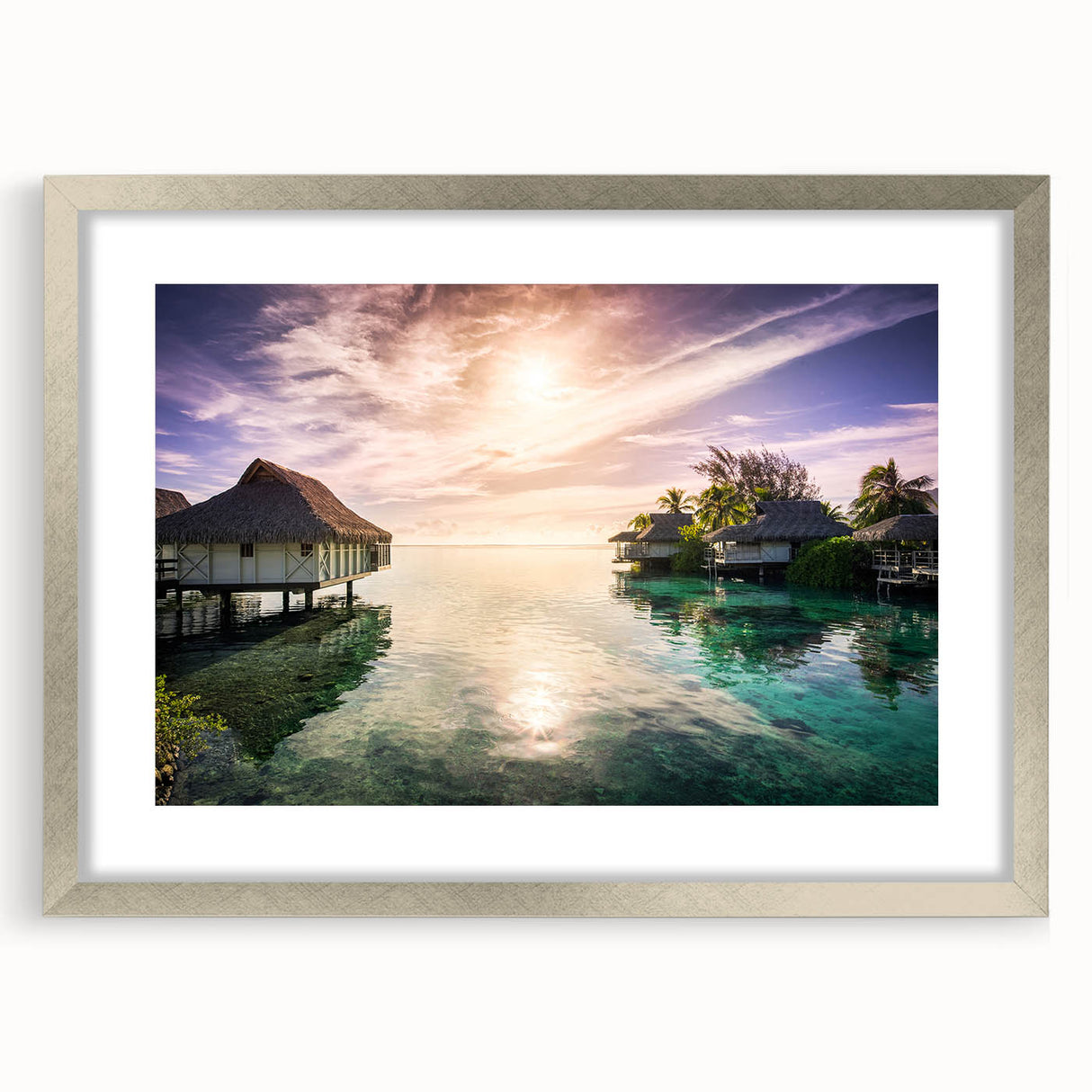 Extra large abstract art print of Caribbean scenery in muted blue and green tones, framed in silver.