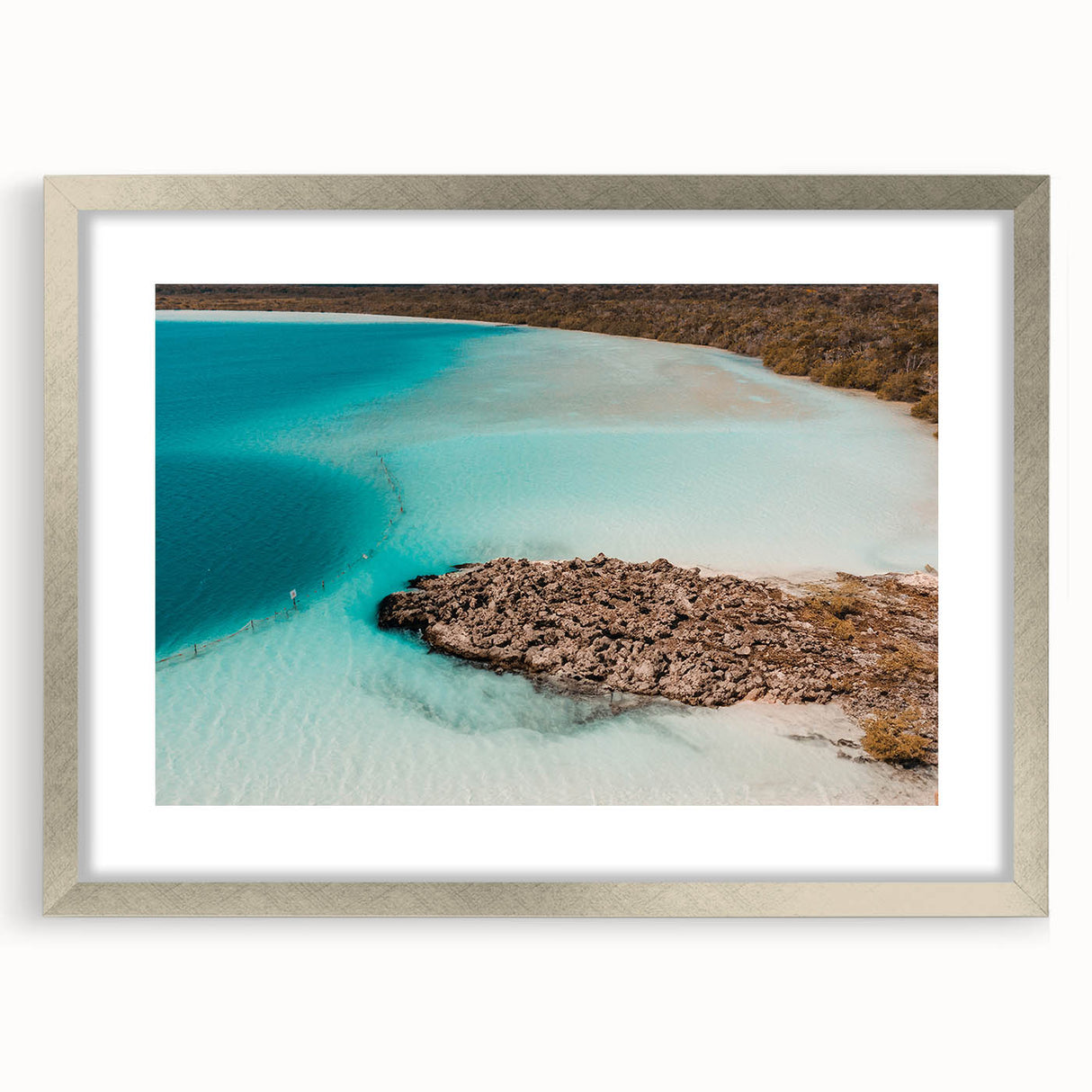 Abstract art print of Quintana Roo scenery in muted blue and green tones, framed in silver, ideal for dining room decor.