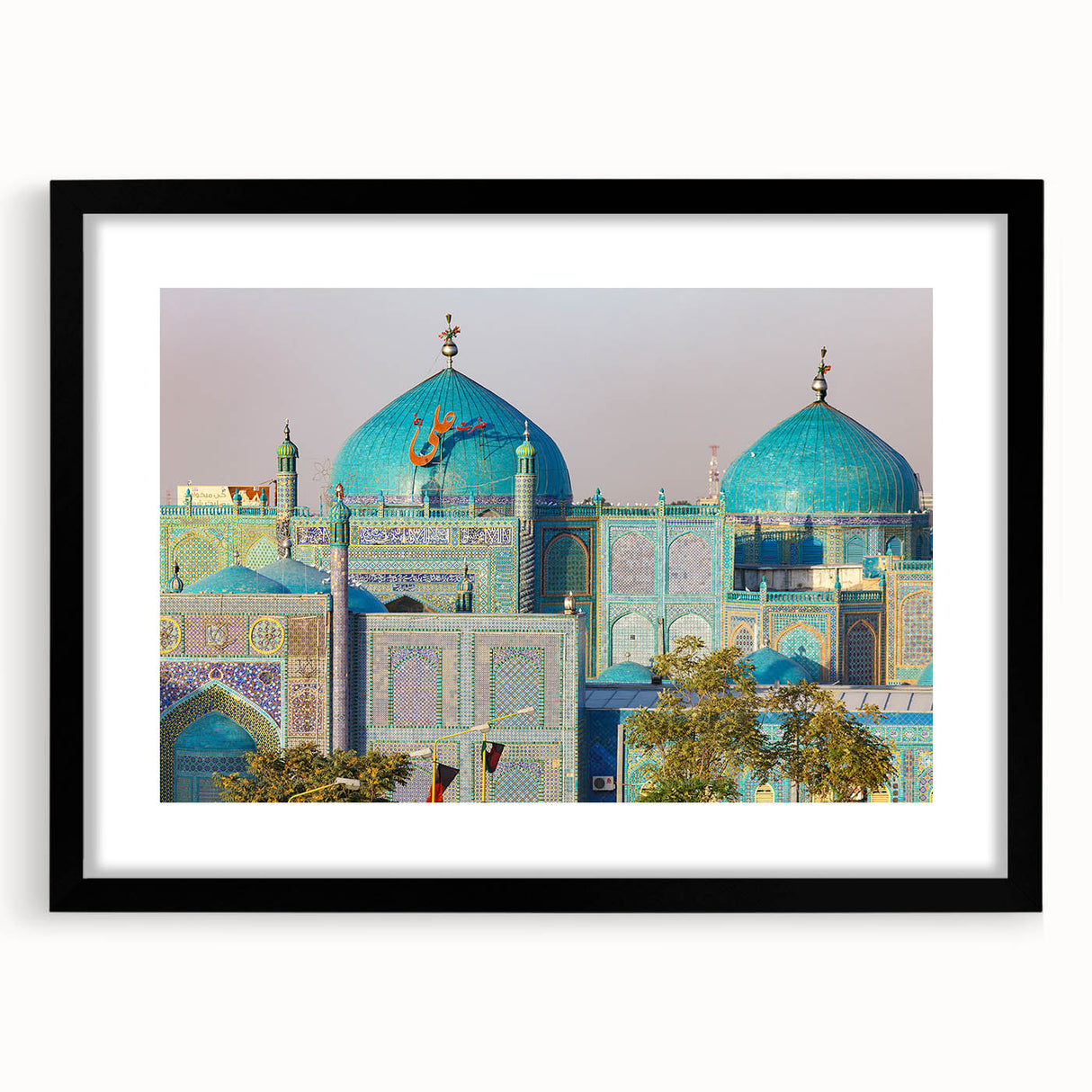 Extra large abstract art print featuring colorful, textured scenery of a Middle Eastern landscape on a black framed mat.