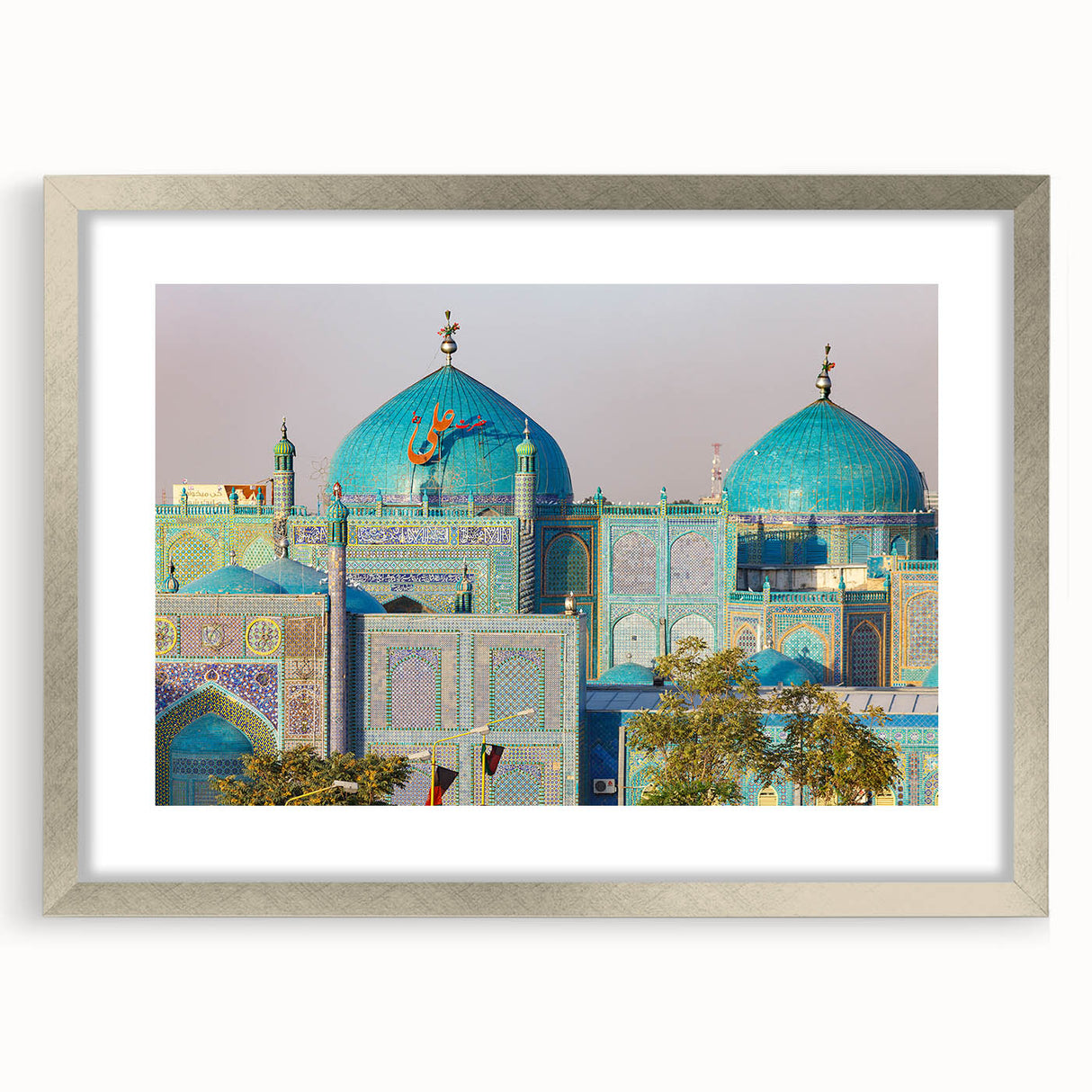 Textured abstract art print of a Middle Eastern scenery in muted earth tones, framed in silver, ideal for bedroom art.
