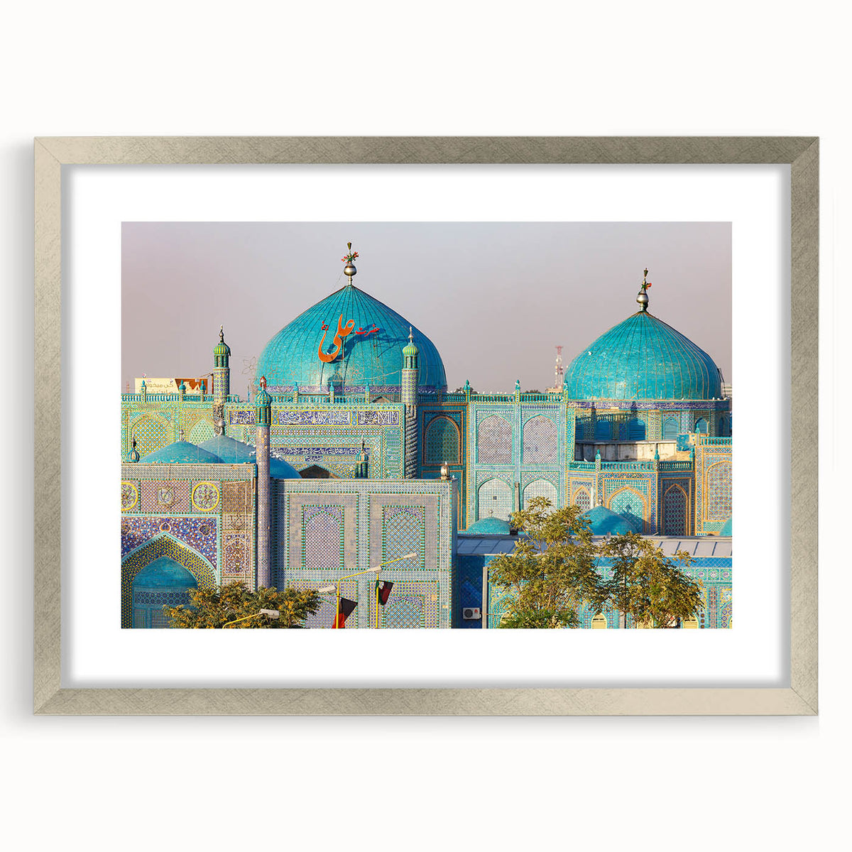 Textured abstract art print of a Middle Eastern scenery in muted earth tones, framed in silver, ideal for bedroom art.