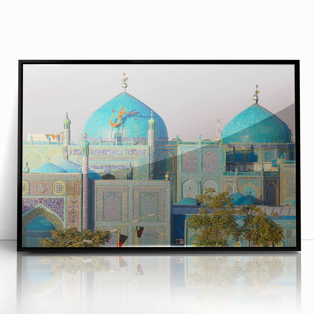 Large abstract wall art featuring a stylized Middle Eastern scenery in muted earth tones, framed in black acrylic.