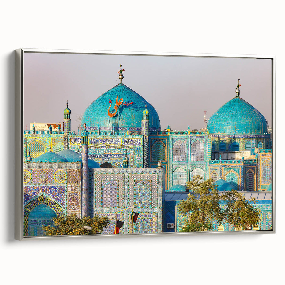 Framed canvas featuring a vintage-style landscape painting of an Afghan scenery in muted earth tones.