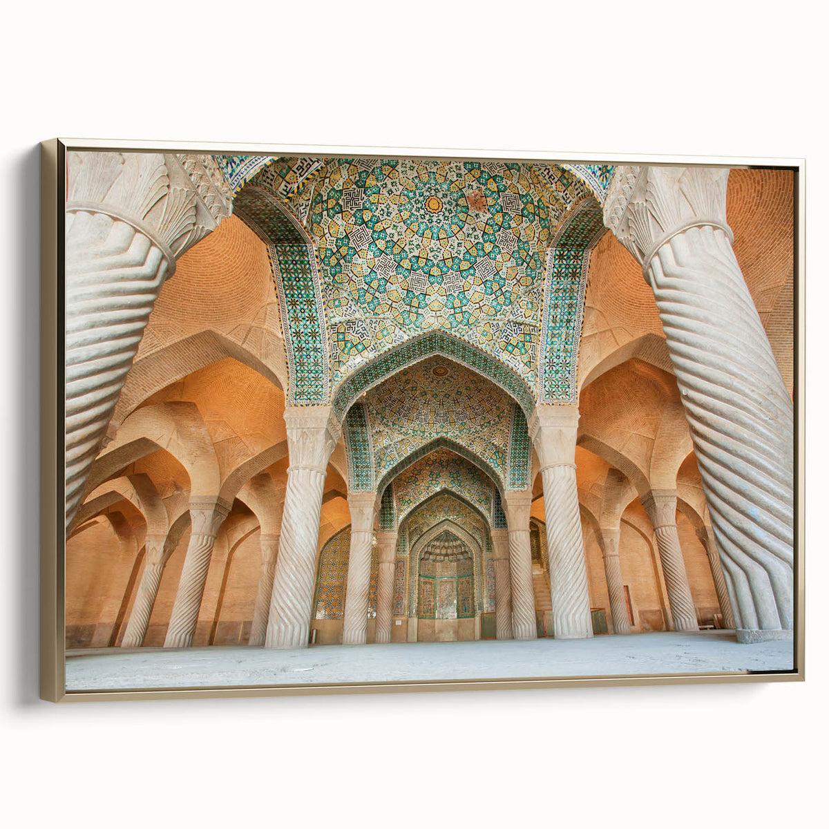 Framed canvas featuring a vintage-style landscape painting of a Middle Eastern scenery in muted gold and black tones.