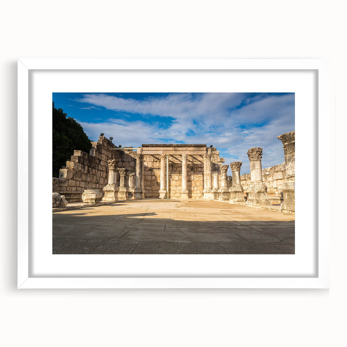 Abstract art print of a Middle Eastern landscape in muted earth tones, framed with a white mat.