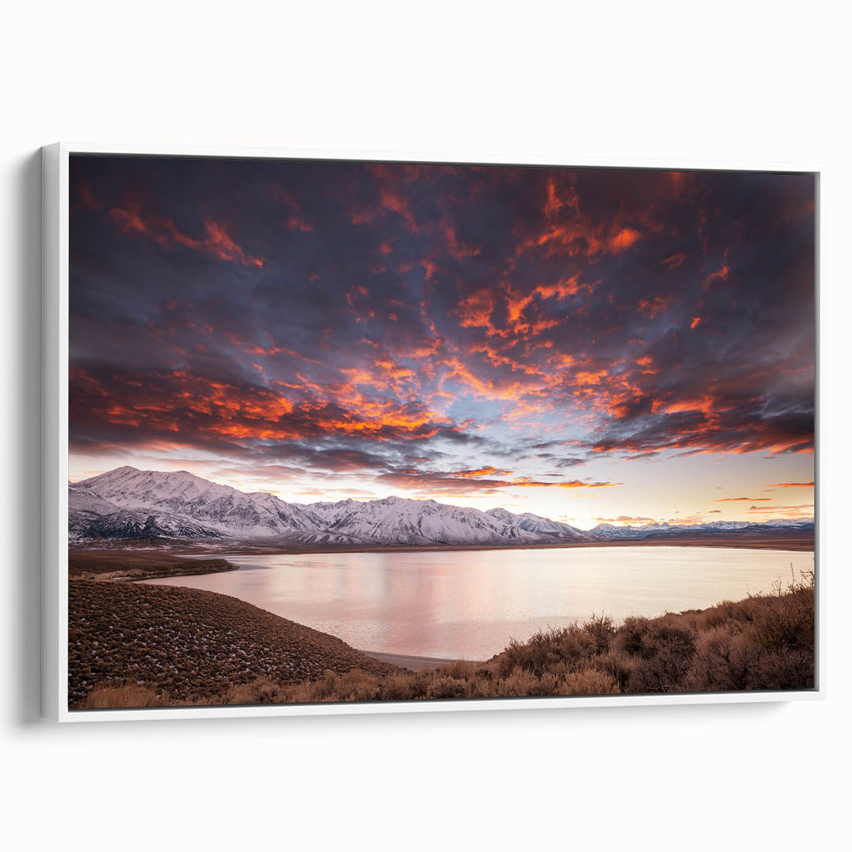 Vintage poster art of the Sierra Nevada on a framed canvas, featuring vibrant colors on a black background.