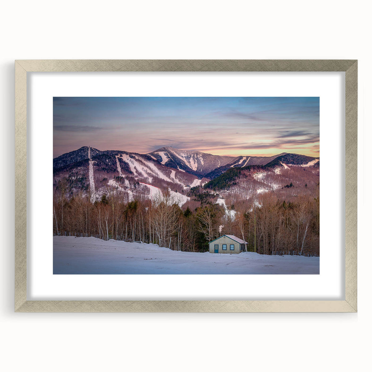 Textured abstract art print of Adirondacks scenery in muted earth tones, framed in silver, suitable for bedroom decor.