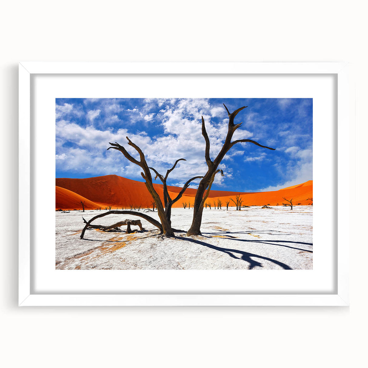 Extra large textured abstract art print of an African scenery in muted earth tones, framed with a white mat.
