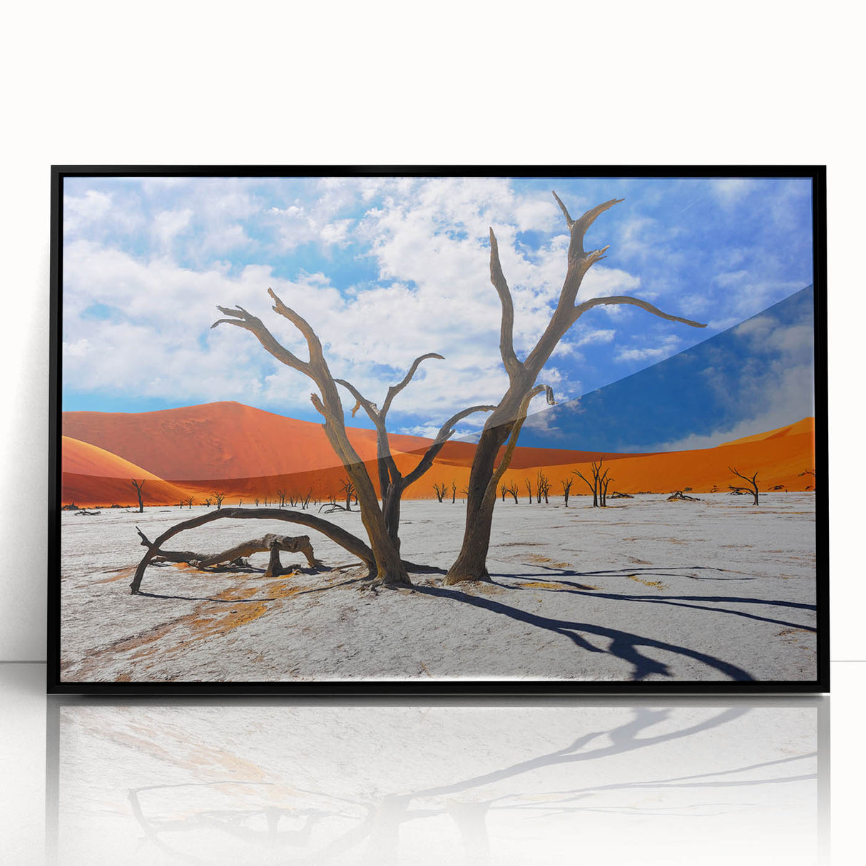 Large abstract wall art depicting a minimalistic Namibia scenery in muted earth tones, framed in black acrylic.