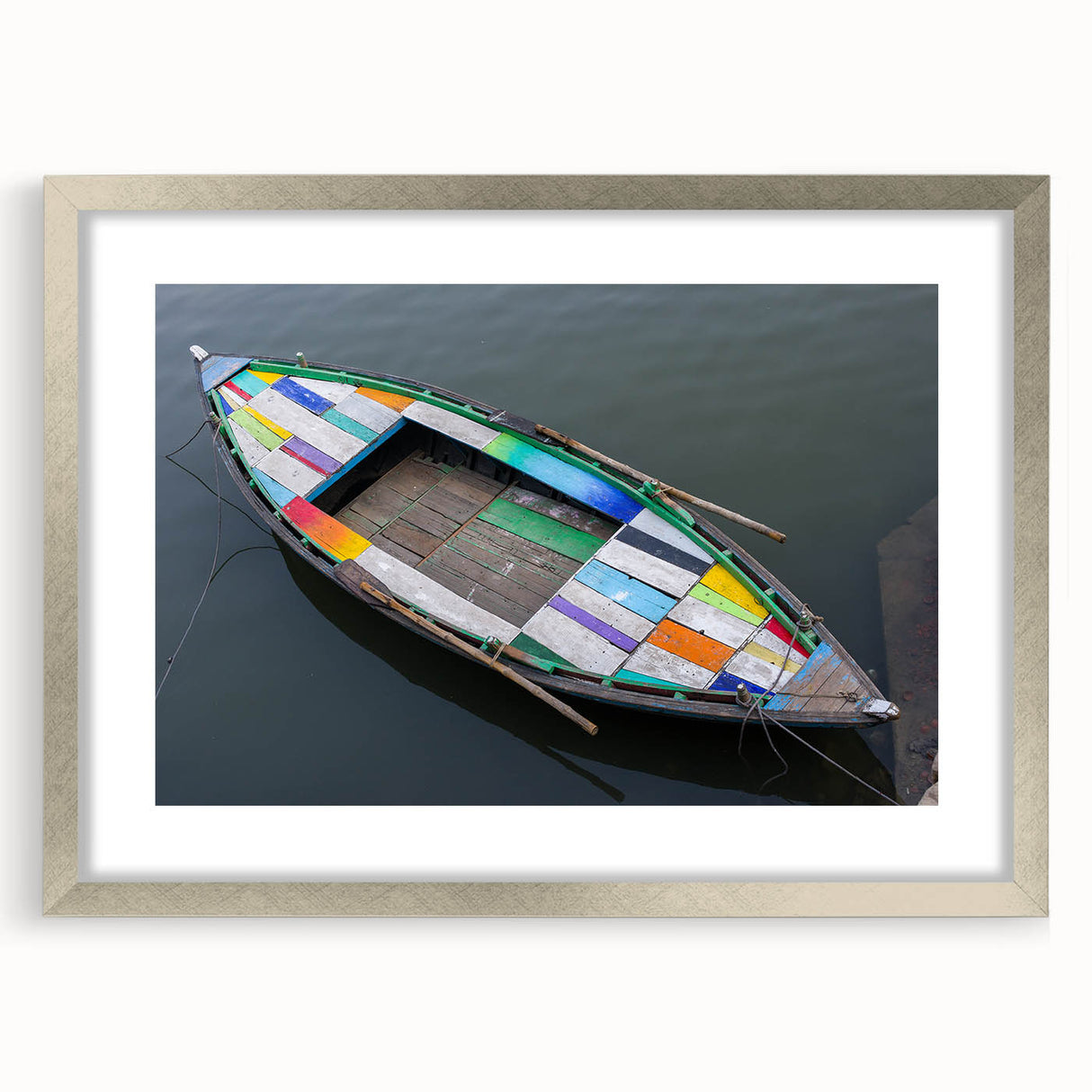 Textured art print depicting an abstract scenery in muted earth tones, framed with a silver mat, suitable for bedroom art.