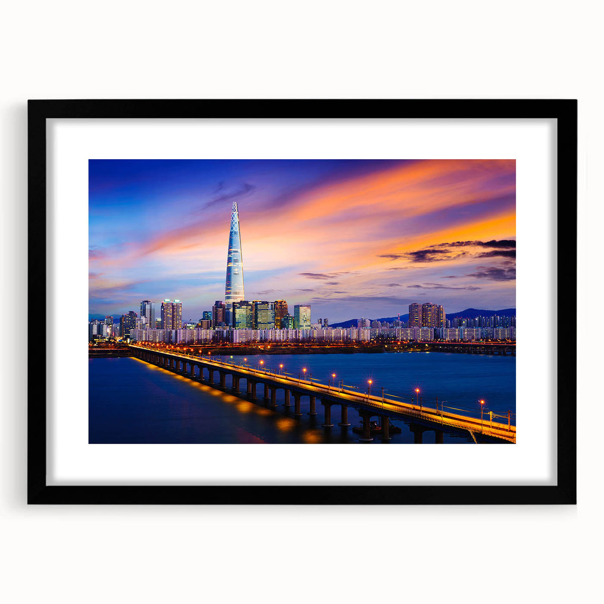 Colorful abstract art print of Seoul skyline with vibrant hues on a textured, extra large canvas, framed in black.