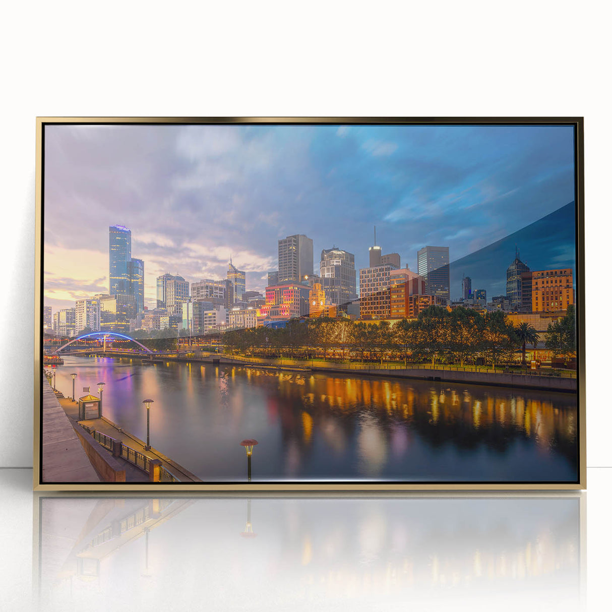 Mid-century modernist art depicting Melbourne skyline in muted gold tones on framed acrylic.