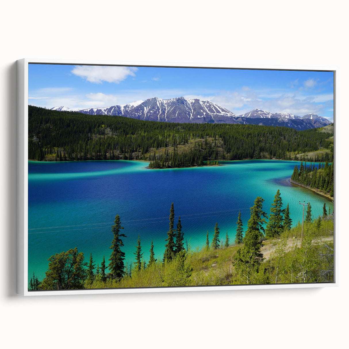 Framed canvas of a vintage poster art depicting Yukon scenery in vibrant colors, ideal for living room decor.