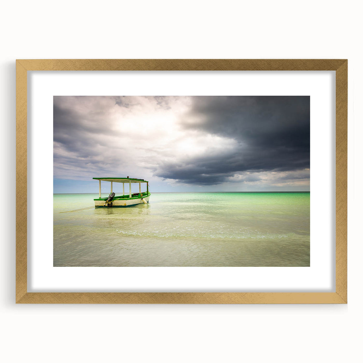 Abstract art print of a Caribbean seascape in vibrant blues and greens, framed in gold.
