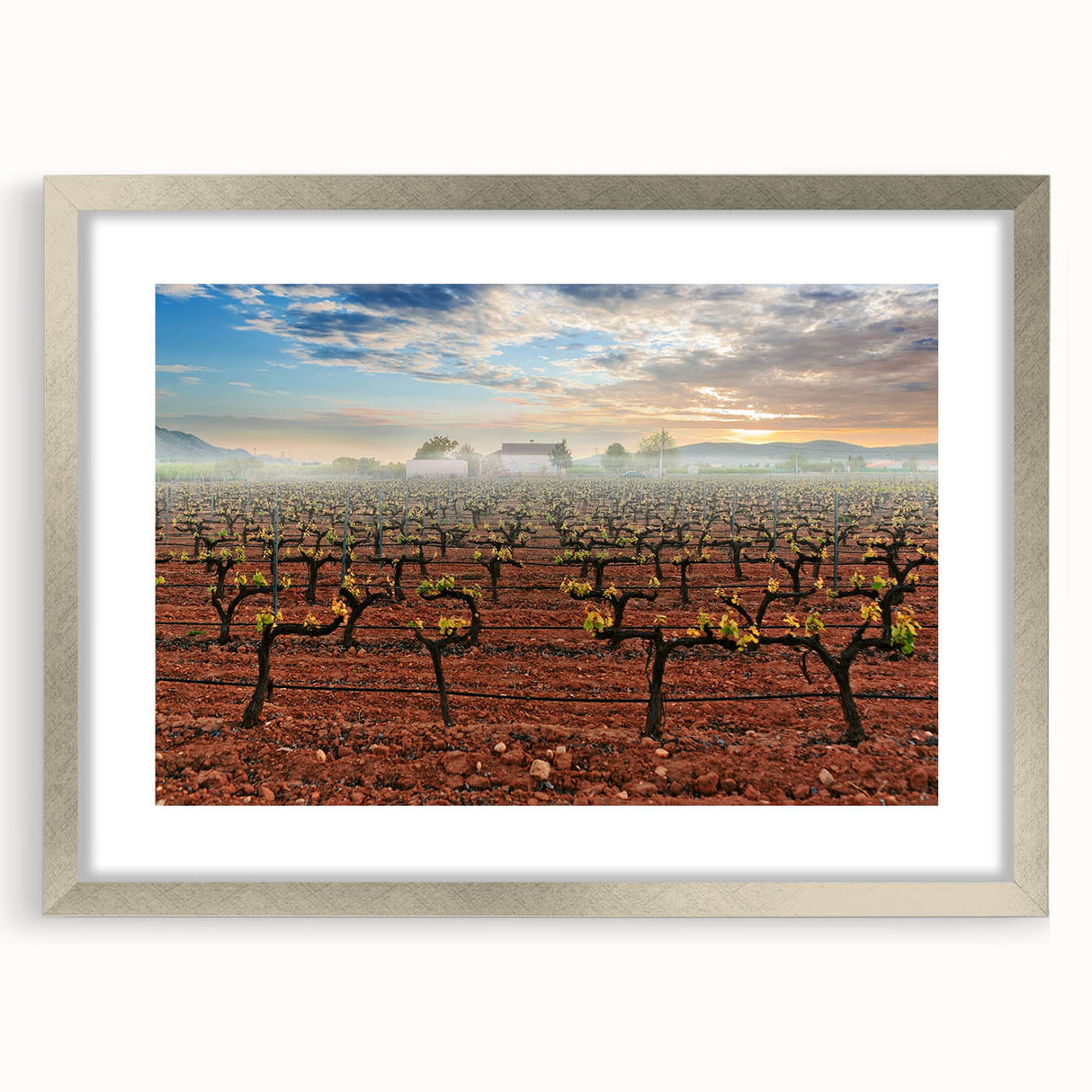 Textured art depicting an abstract European scenery in muted earth tones, framed with a silver mat.